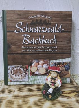 Schwarzwald Backbuch mit Schwarzwaldmädel sitzend