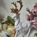 DH10000 Hirsch Hirschsprung stehend Bollenhut weis-gold