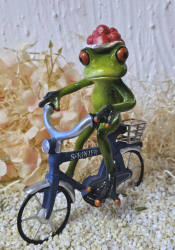 GLF2009 Glücksfrosch Fahrradfahrer mit blauem Fahrrad und großem Bollenhut