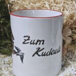 ST200 Schwarzwaldtasse Zum Kuckuck roter Rand roter Henkel